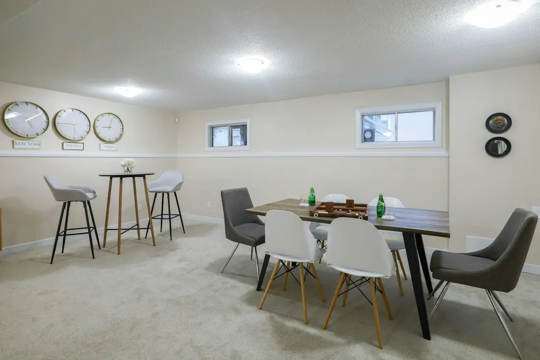 A finished basement fitted out as a lounge and dining space