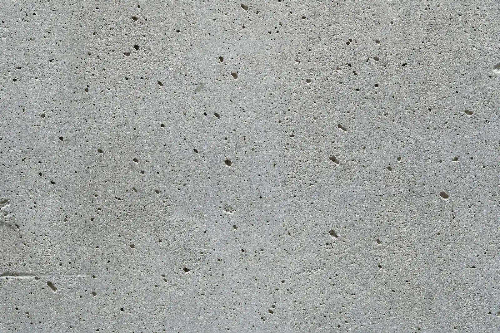 A formed concrete surface with tie marks